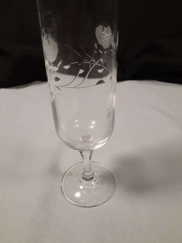 Two rose cut crystal wine glasses  17 and 19 cms tall