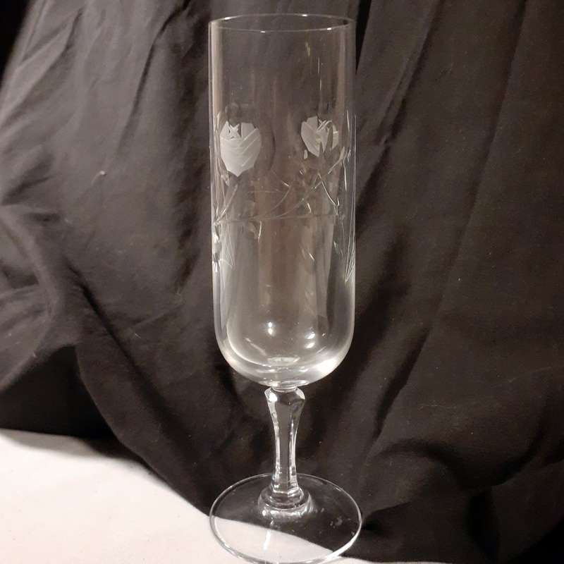 Two rose cut crystal wine glasses  17 and 19 cms tall