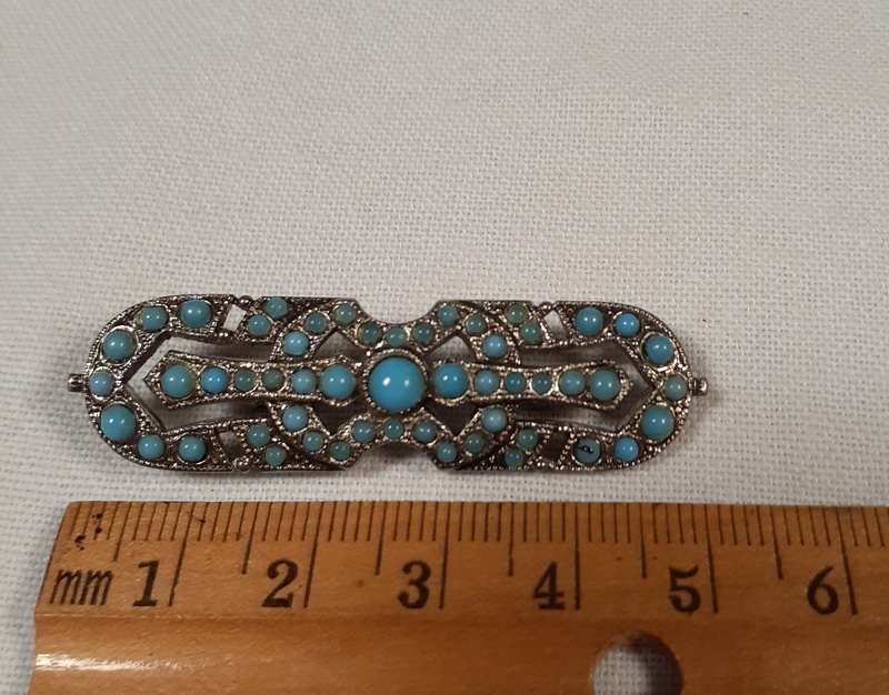 Deco  brooch with blue glass "stones"