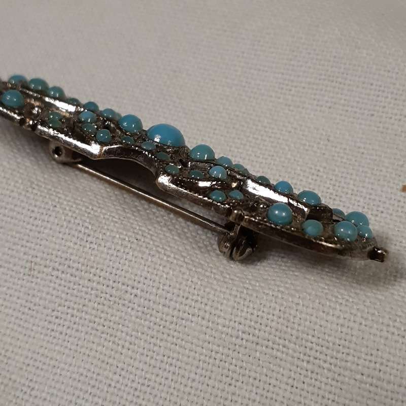 Deco  brooch with blue glass "stones"