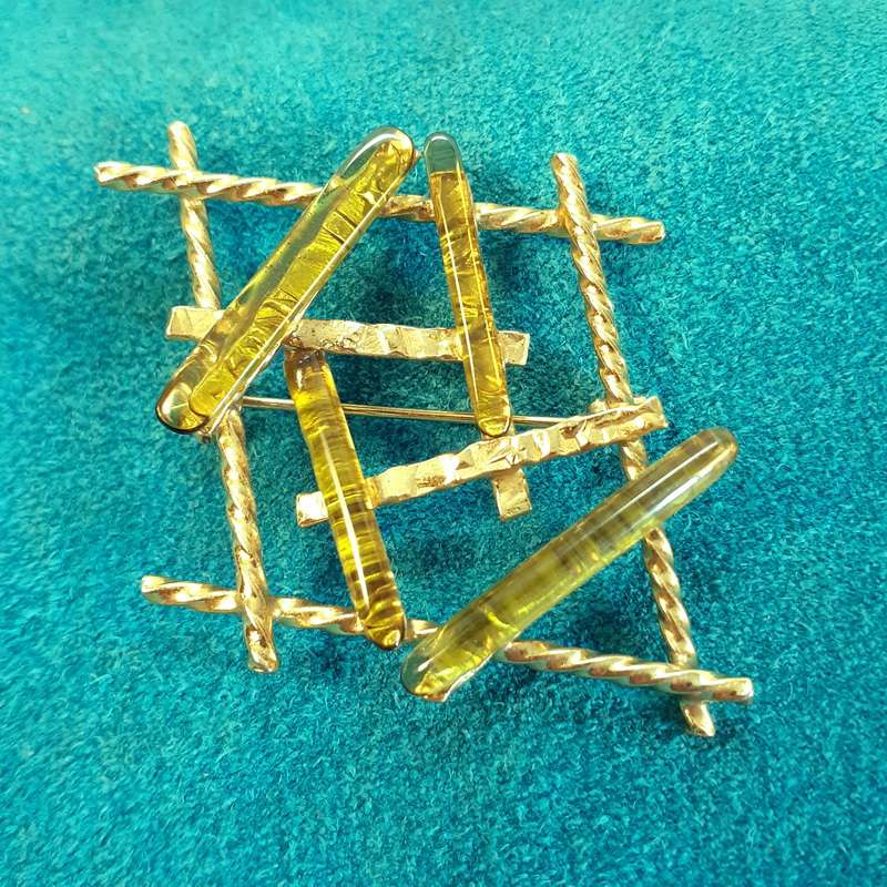 Vintage gold brooch with pale green stones/glass
