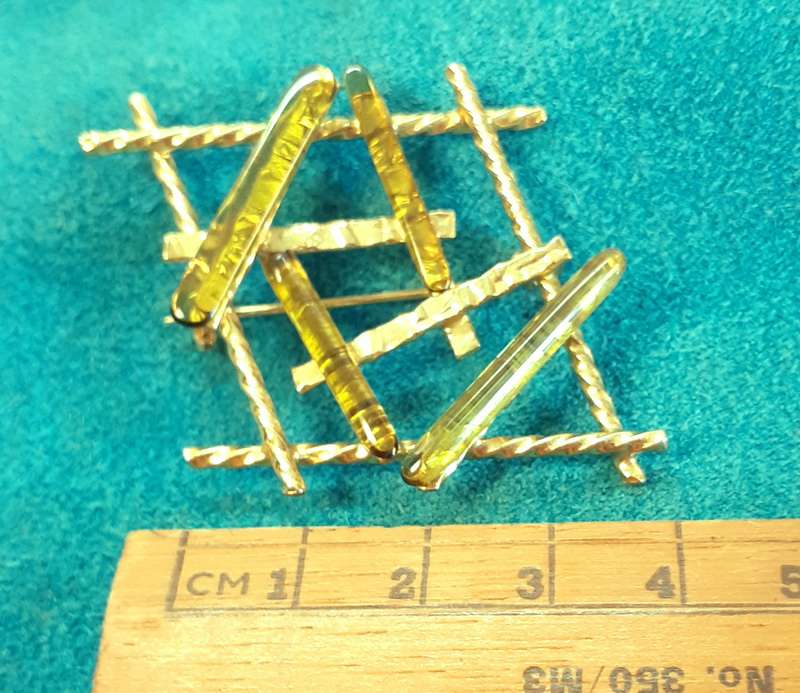 Vintage gold brooch with pale green stones/glass