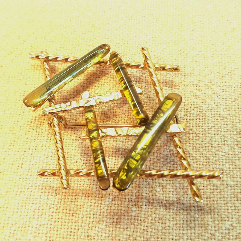 Vintage gold brooch with pale green stones/glass