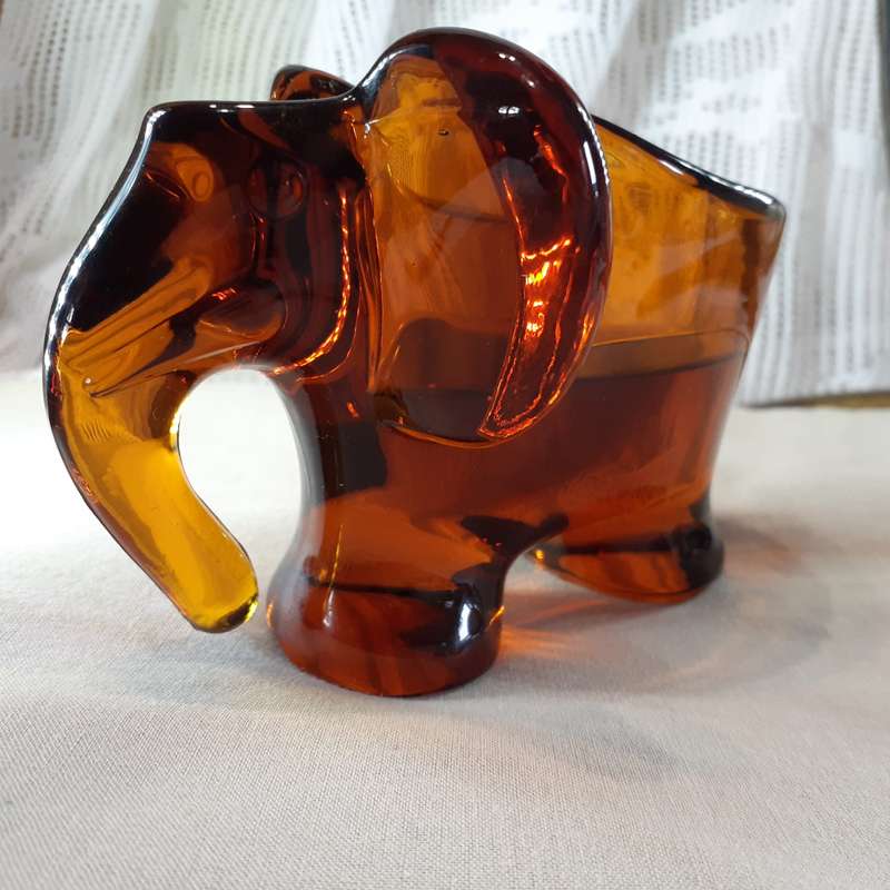 Glass Elephant figurine ashtray - heavy amber glass