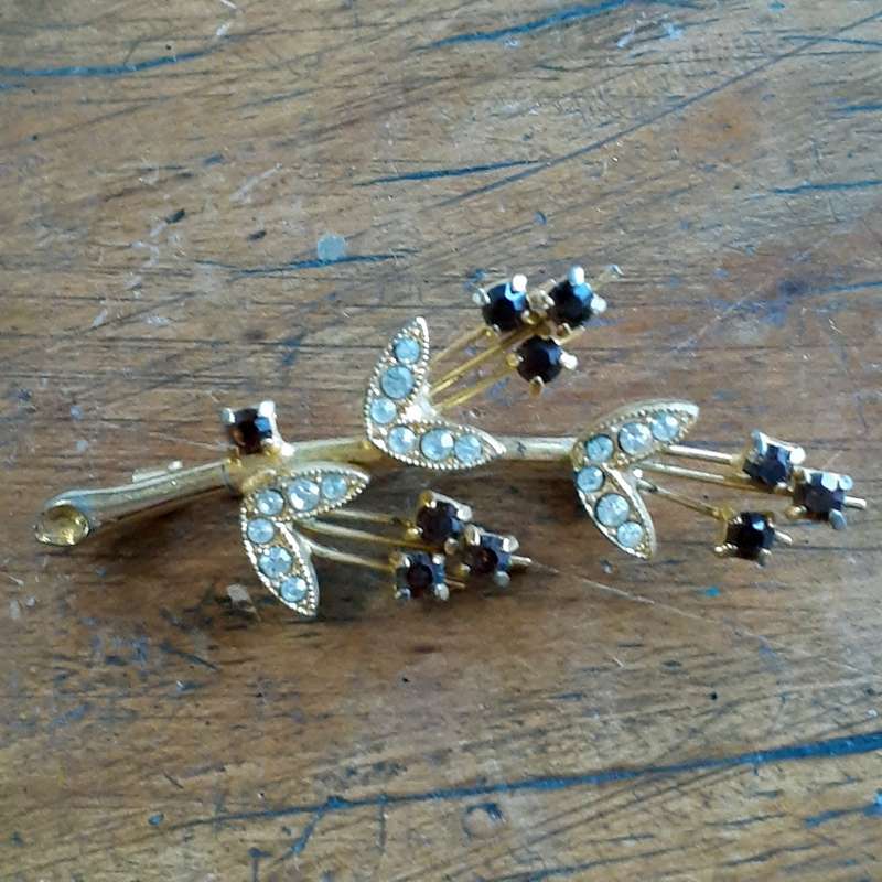 Gilt metal brooch with amber and clear glass stones.  Floral vintage