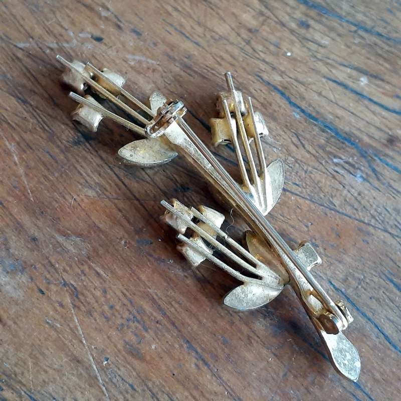 Gilt metal brooch with amber and clear glass stones.  Floral vintage