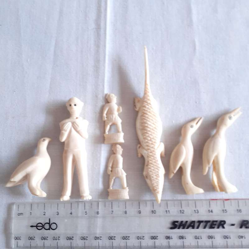 7 little carved bone figurines birds and a crocodile