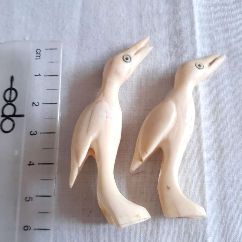 7 little carved bone figurines birds and a crocodile