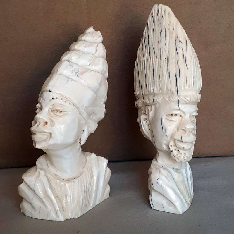 Two carved bone african heads figurines -11cms tall