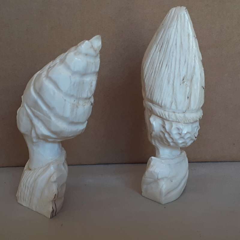 Two carved bone african heads figurines -11cms tall