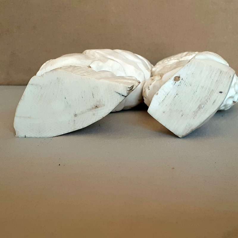 Two carved bone african heads figurines -11cms tall
