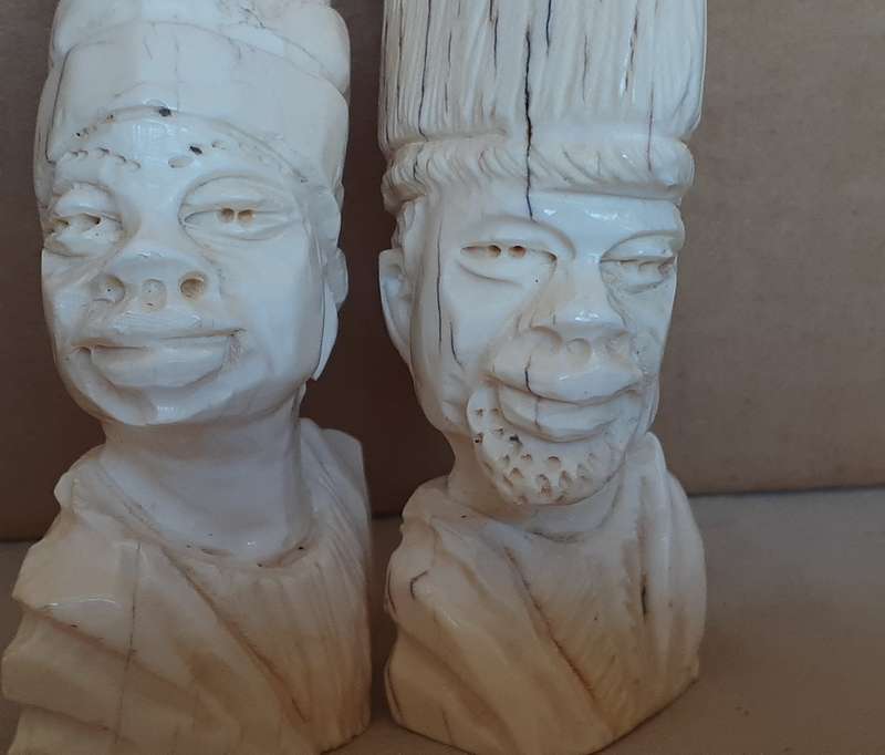 Two carved bone african heads figurines -11cms tall