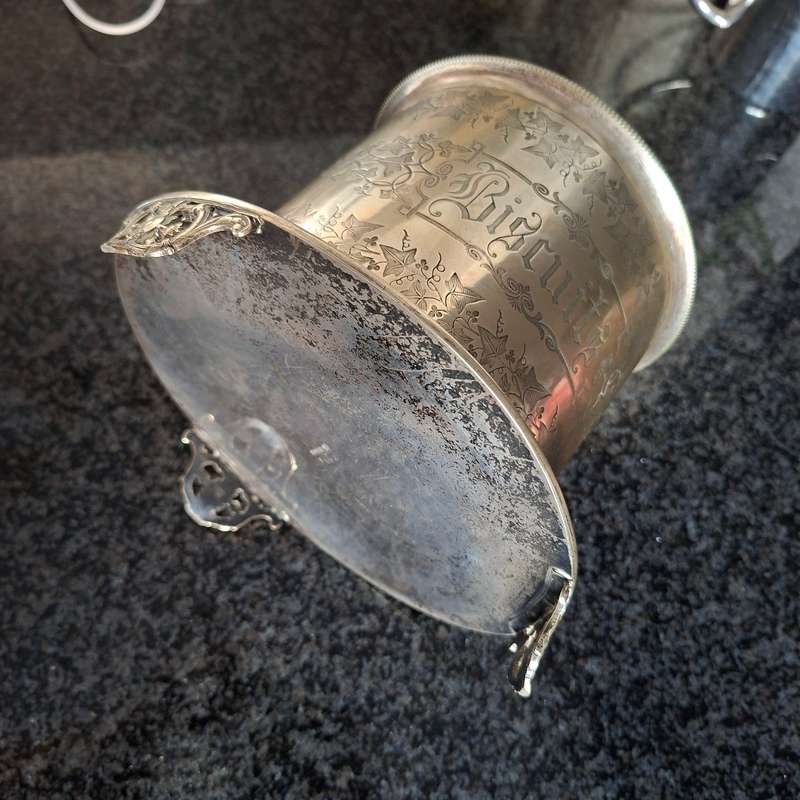 Antique silverplate biscuit barrel on three feet