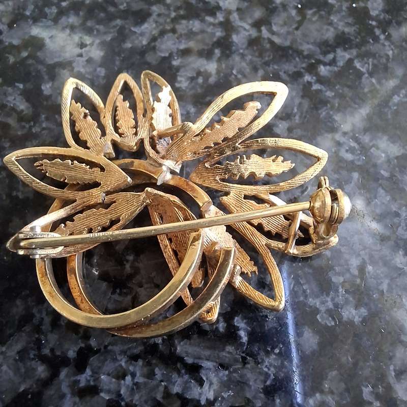 2 gold metal brooches stamped "double" and another indistinct mark.