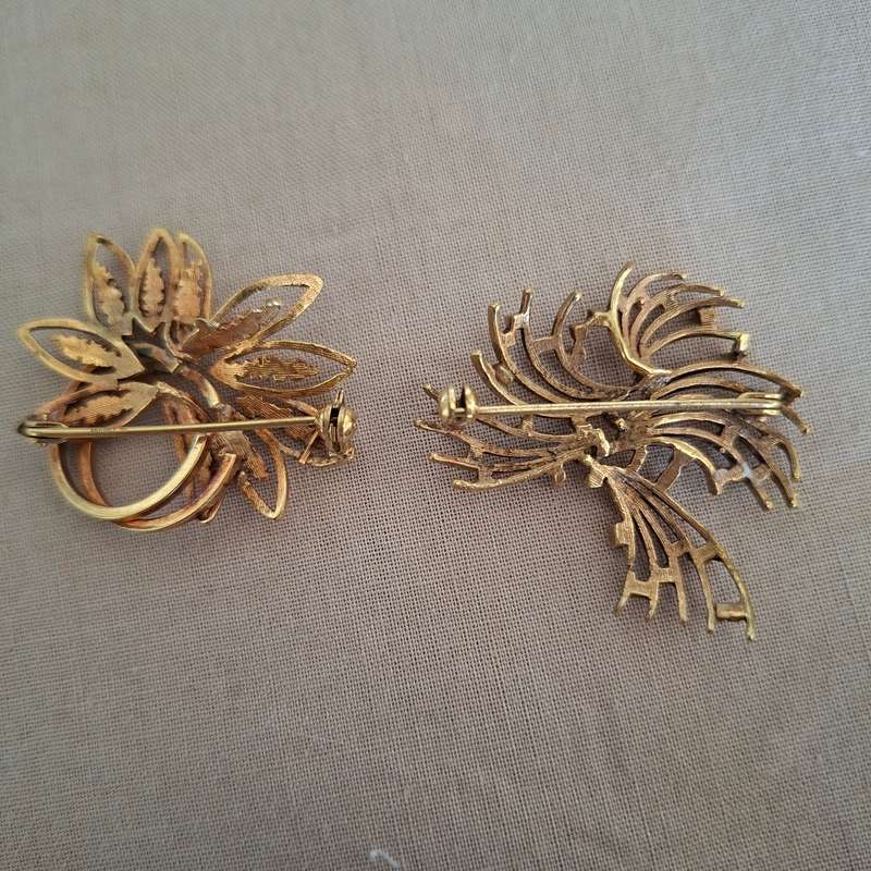 2 gold metal brooches stamped "double" and another indistinct mark.