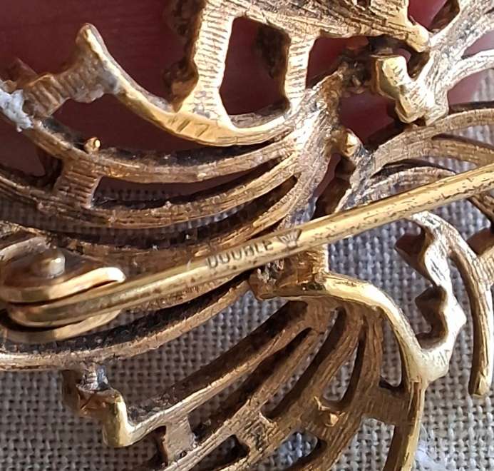 2 gold metal brooches stamped "double" and another indistinct mark.