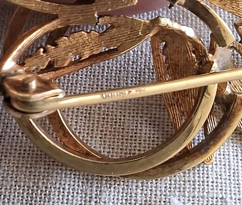 2 gold metal brooches stamped "double" and another indistinct mark.