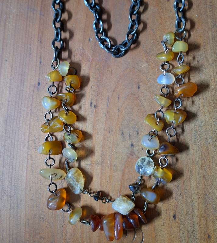 Polished orange agate necklace on heavy chain.