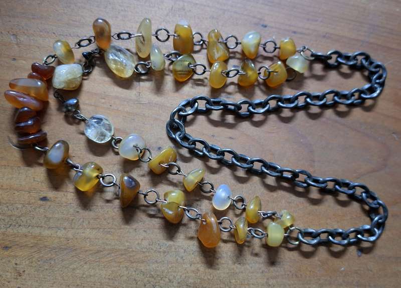 Polished orange agate necklace on heavy chain.