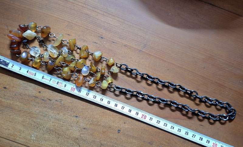 Polished orange agate necklace on heavy chain.