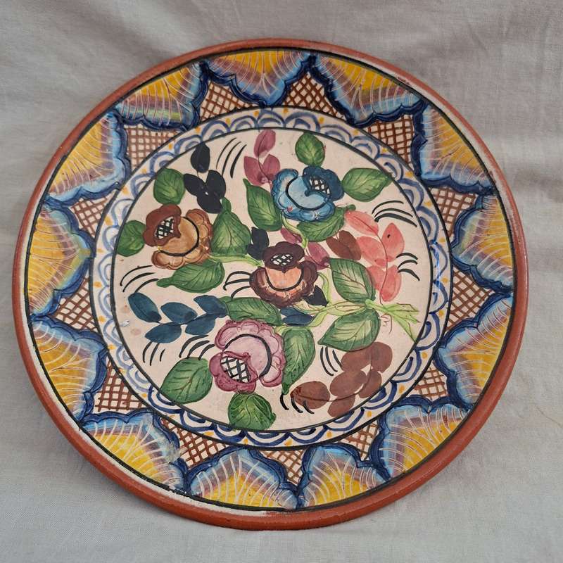 Hand decorated Portugese terra cotta Plate signed - flowers and leaves