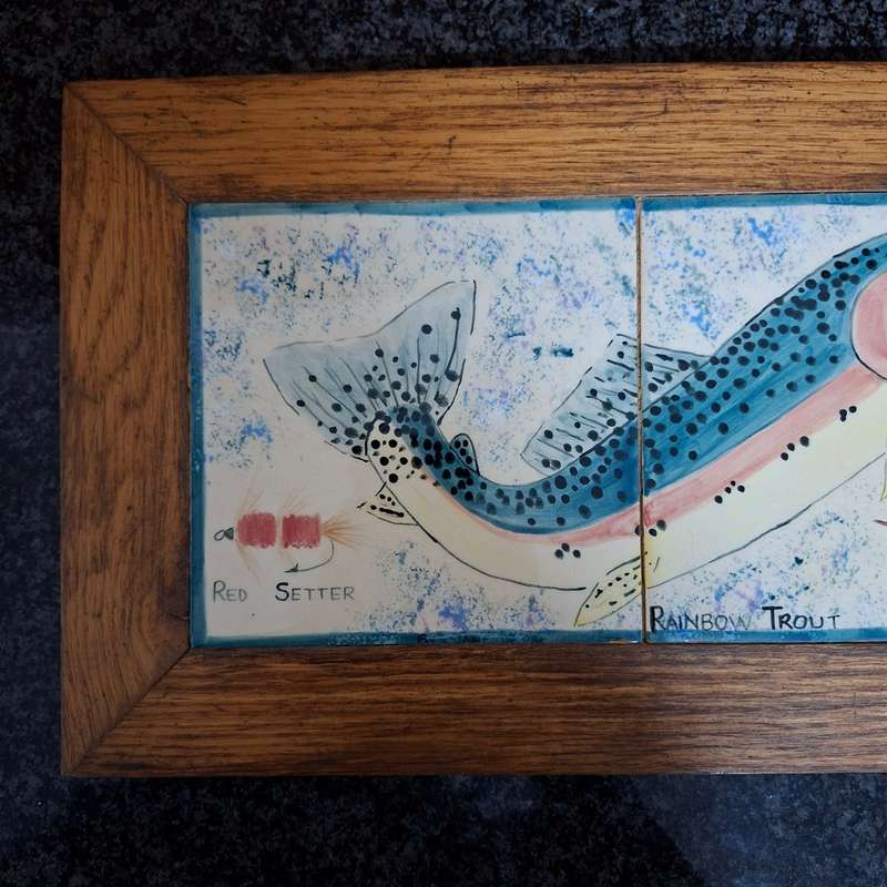 2 painted tile pictures - rainbow trout and flies set in oak frames
