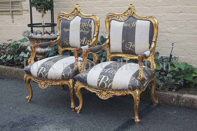 A Pair of 20th Century Circa 1940s French Style Carved and Gilded Armchairs upholtered in a Cu...