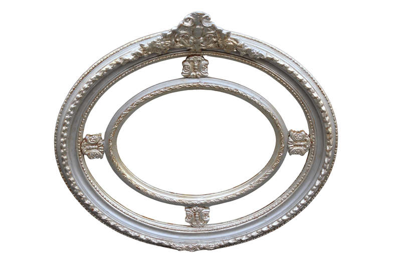 Ornate oval silver gilded mirror with crown