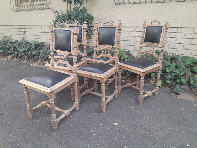 A 20th Century Set of Six of Carved Walnut Dining Chairs Upholstered in Leather and in a Contempo...