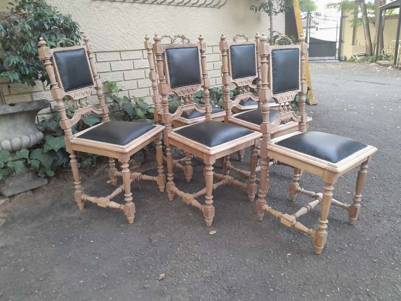 A 20th Century Set of Six of Carved Walnut Dining Chairs Upholstered in Leather and in a Contempo...