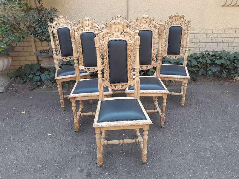 A 19th Century French Set of Six Ornately Carved Oak Chairs in a Contemporary Bleached Finish and...