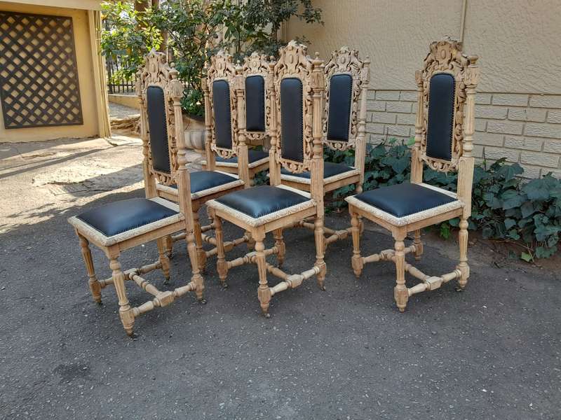 A 19th Century French Set of Six Ornately Carved Oak Chairs in a Contemporary Bleached Finish and...