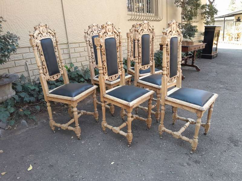 A 19th Century French Set of Six Ornately Carved Oak Chairs in a Contemporary Bleached Finish and...