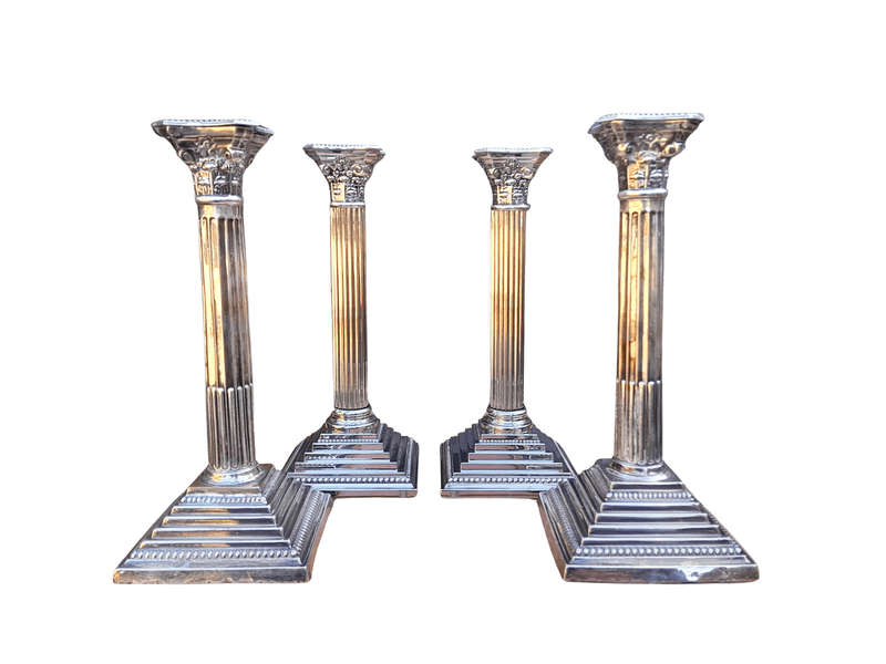 A Set of Four 20th Century Elizabeth II Silver-Plated Corinthian Column Candlesticks