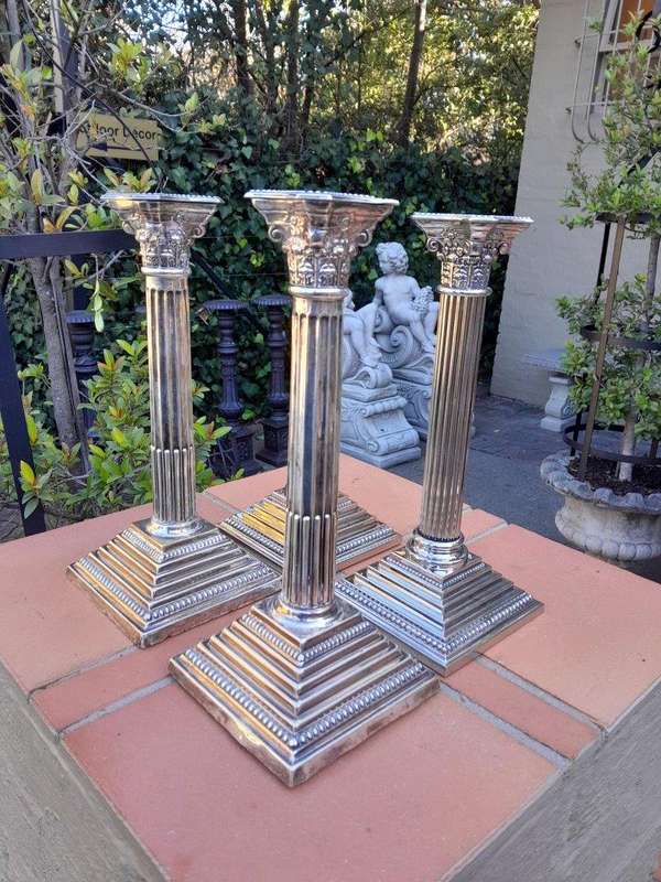A Set of Four 20th Century Elizabeth II Silver-Plated Corinthian Column Candlesticks
