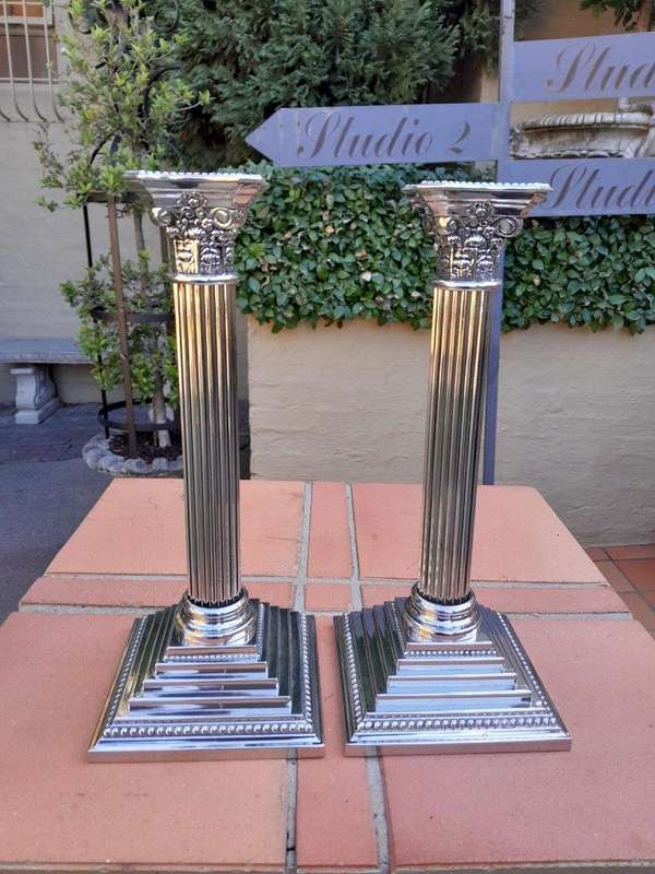 A Set of Four 20th Century Elizabeth II Silver-Plated Corinthian Column Candlesticks