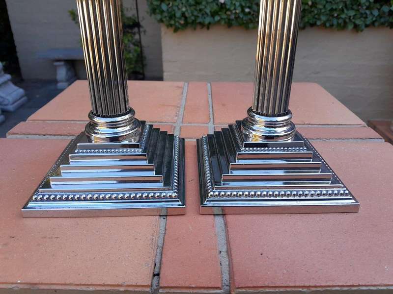 A Set of Four 20th Century Elizabeth II Silver-Plated Corinthian Column Candlesticks