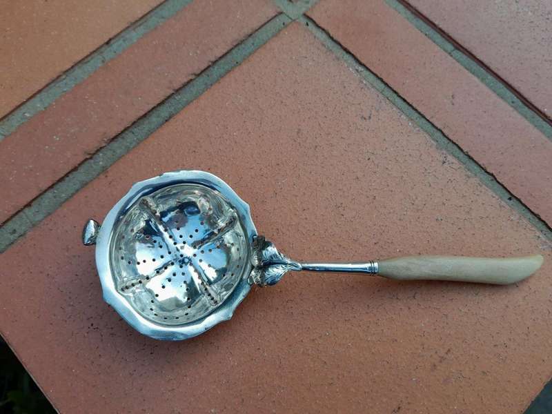 A Silver Tea Strainer with Bone Handle 38g weight