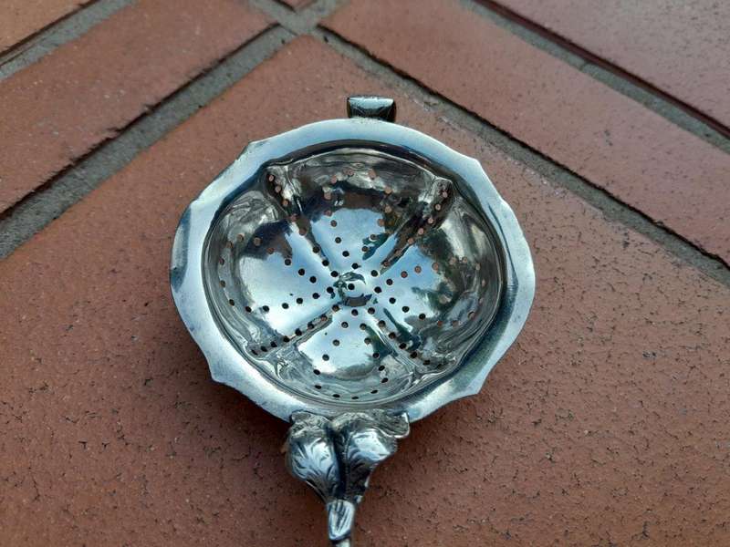 A Silver Tea Strainer with Bone Handle 38g weight