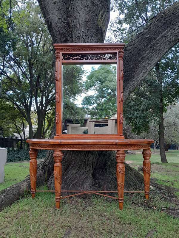 A 20th Century Set of Carved Wooden Console Table with Matching Mirror