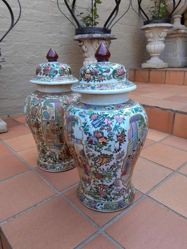 A 20th Century Pair of Chinese Famille Rose Porcelain Covered Urns