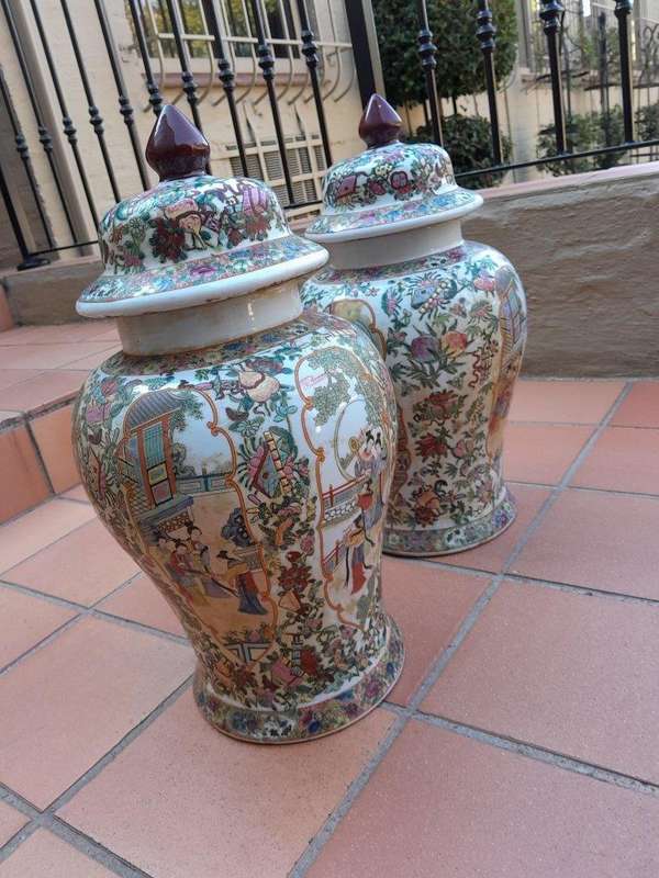 A 20th Century Pair of Chinese Famille Rose Porcelain Covered Urns