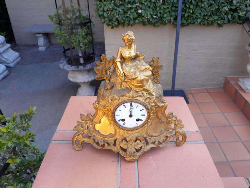 A 19th Century French Gilt Spelter Clock with Pendulum and Key