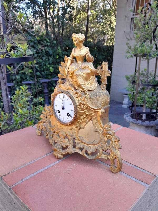 A 19th Century French Gilt Spelter Clock with Pendulum and Key