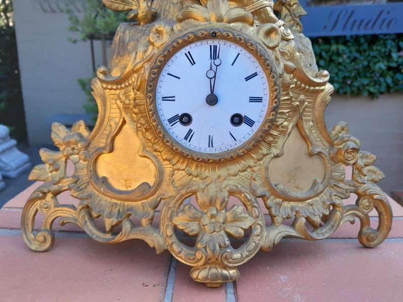 A 19th Century French Gilt Spelter Clock with Pendulum and Key