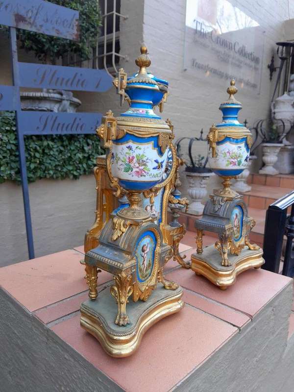 A 19th Century French  Gilt Metal And Porcelain Clock Garniture Set On Original Giltwood Bases A...