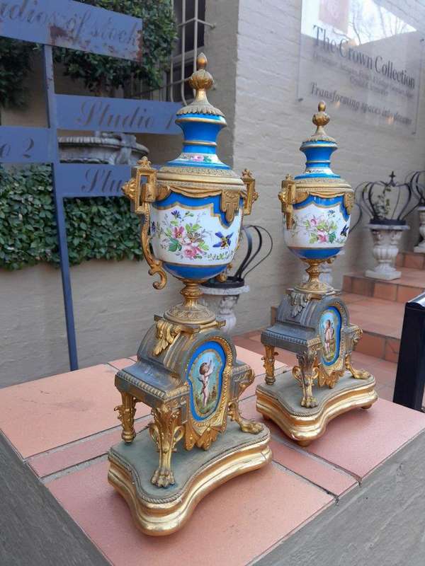 A 19th Century French  Gilt Metal And Porcelain Clock Garniture Set On Original Giltwood Bases A...
