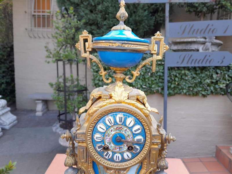 A 19th Century French  Gilt Metal And Porcelain Clock Garniture Set On Original Giltwood Bases A...