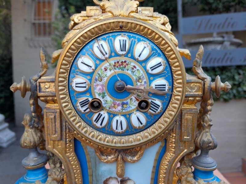 A 19th Century French  Gilt Metal And Porcelain Clock Garniture Set On Original Giltwood Bases A...