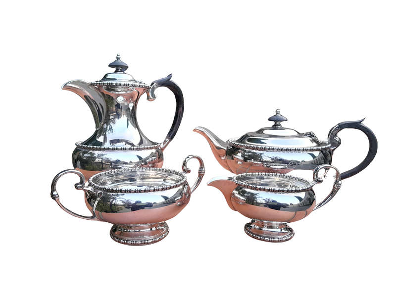 A 20th Century Silver-Plated Walker and Hall 4 piece Tea Set with Wooden Handles